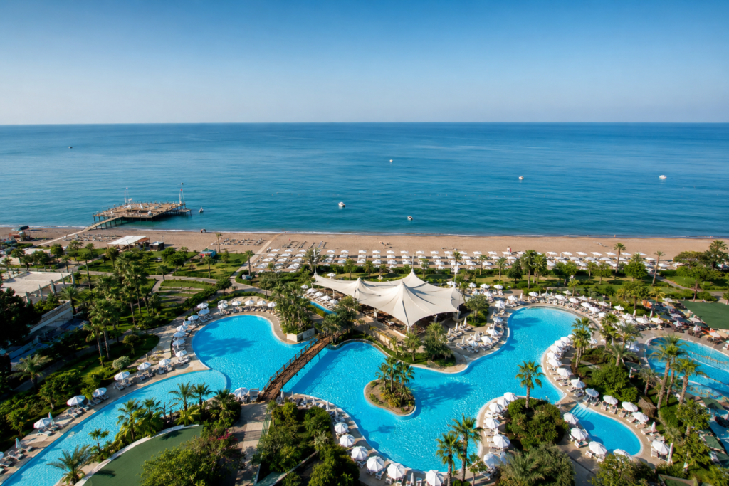 Luxury all-inclusive resort in Antalya Turkey – stunning pool complex with private sandy beach and Mediterranean Sea views