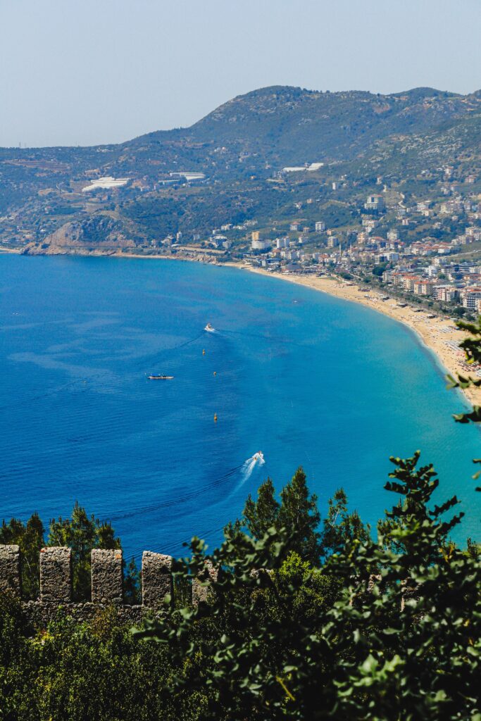 Panoramic view of Alanya coastline, beach, and historic castle