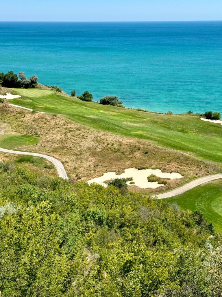 Aerial view of a golf course beside the ocean in Belek, Antalya