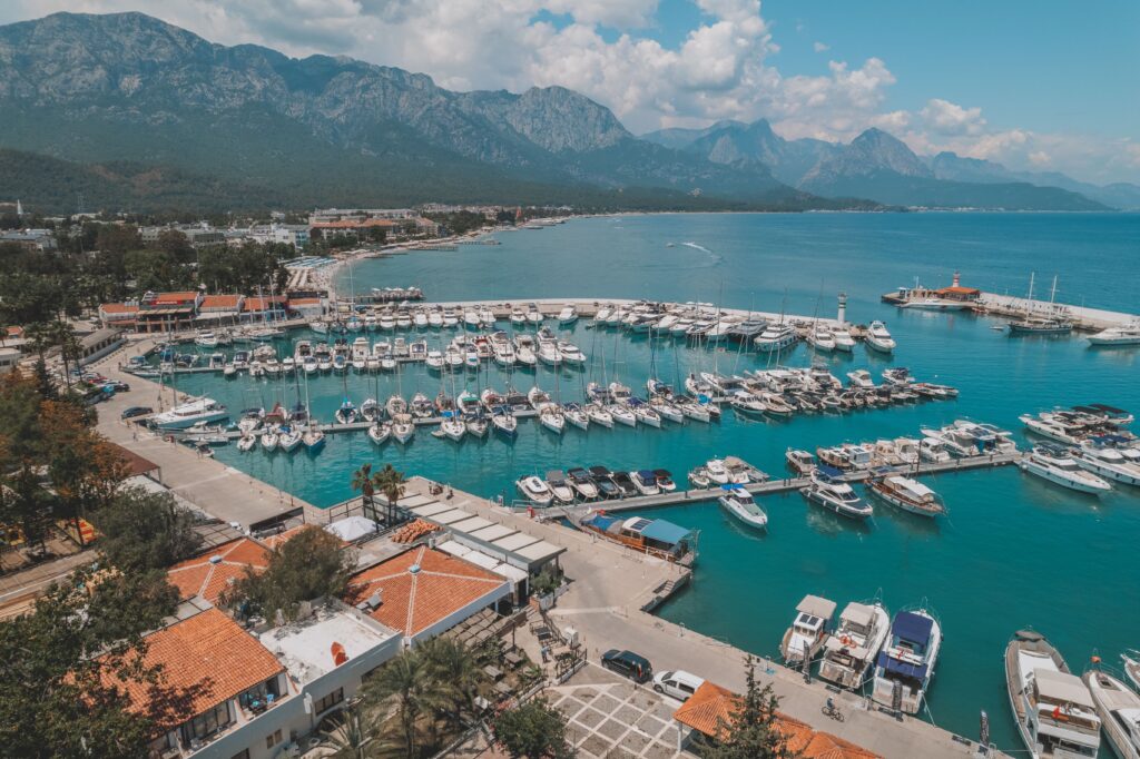 Aerial view of Kemer marina with yachts and mountains, Antalya