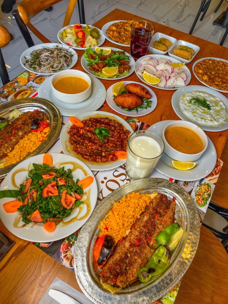 A vibrant spread of traditional Turkish dishes on a wooden table