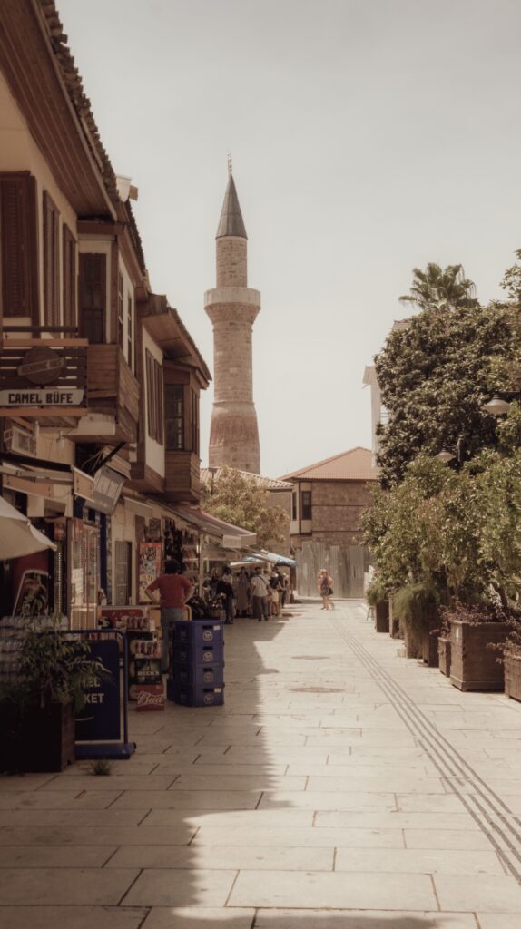 Charm of an ancient street with shops and a tower in Kaleici, Antalya