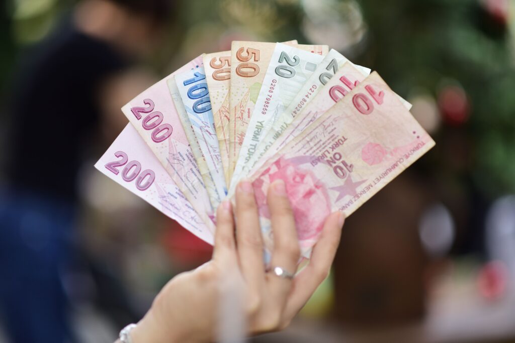 Close-up of Turkish Lira banknotes held outdoors