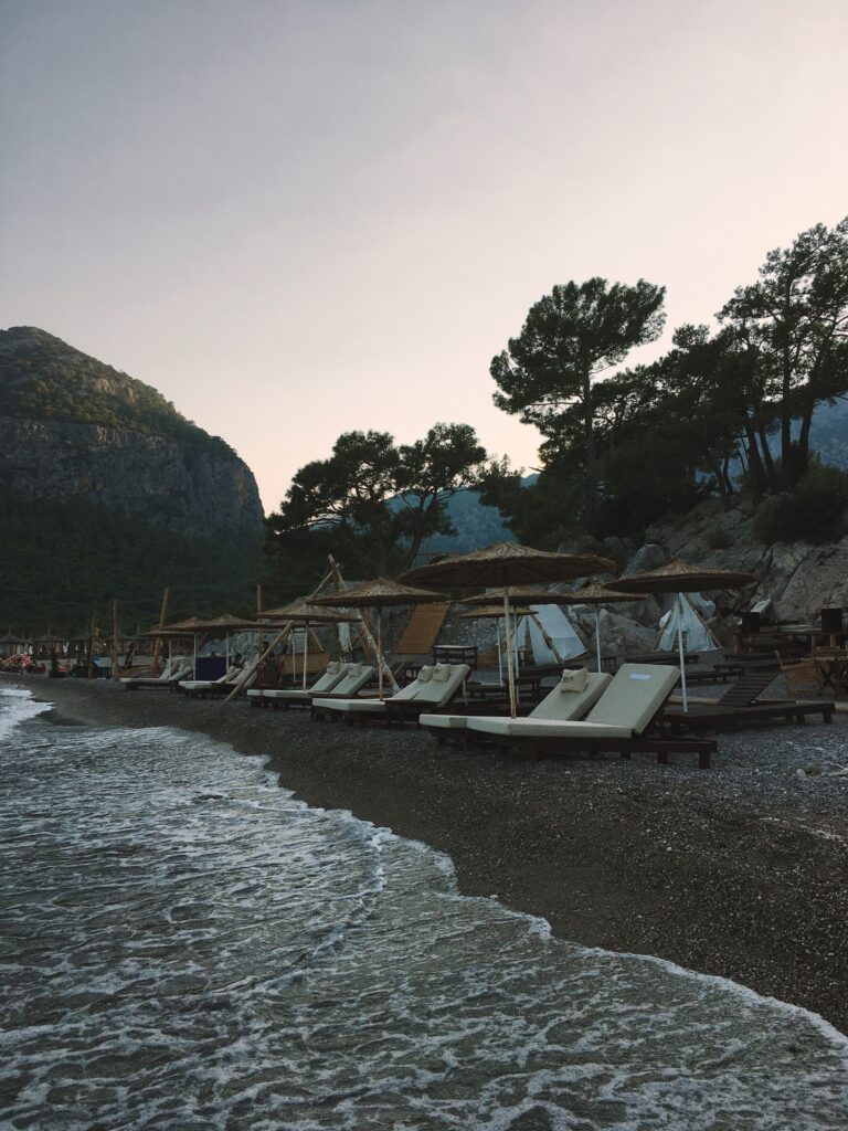 Relaxing beach scene in Antalya with sun loungers and calm water
