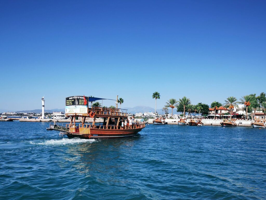 Vibrant Antalya harbor with traditional boats and clear blue waters