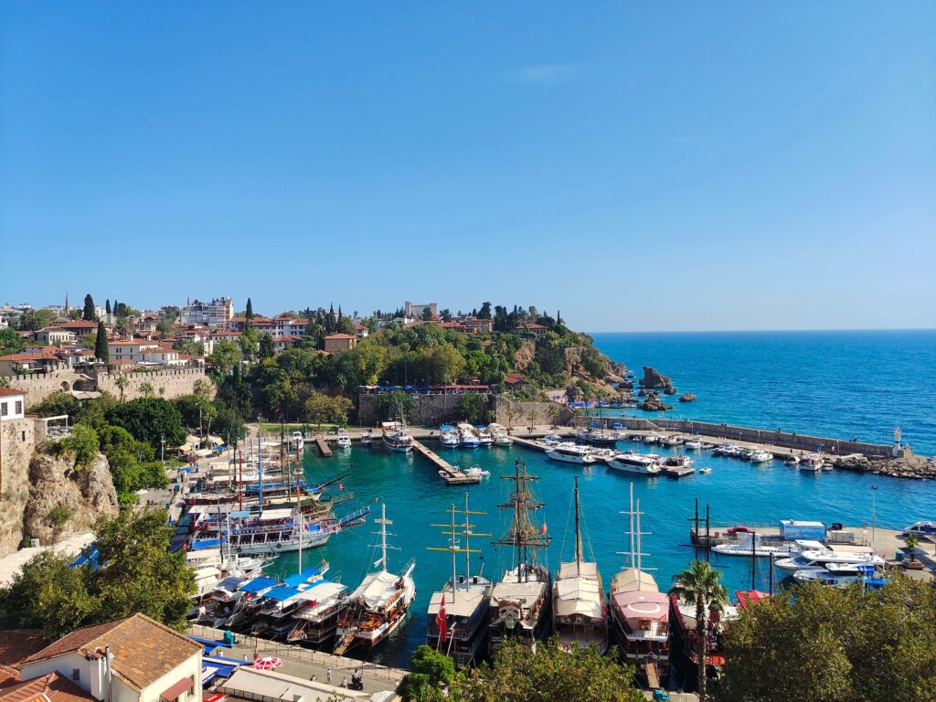 View of Antalya's harbor with boats and clear blue sea
