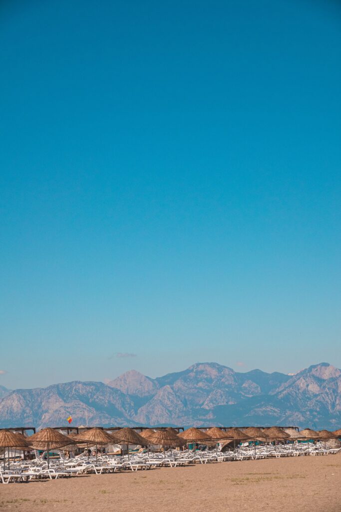 Serene beach with majestic mountain view near Lara Beach, Antalya