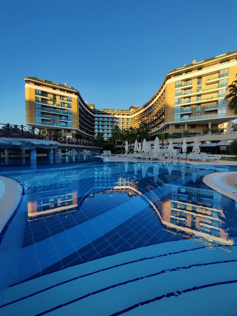 Luxury resort infinity pool at sunset in Antalya, Turkey