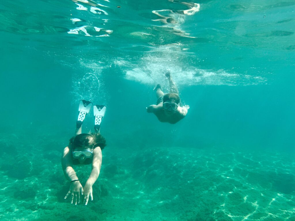 Underwater adventure snorkeling in clear blue sea