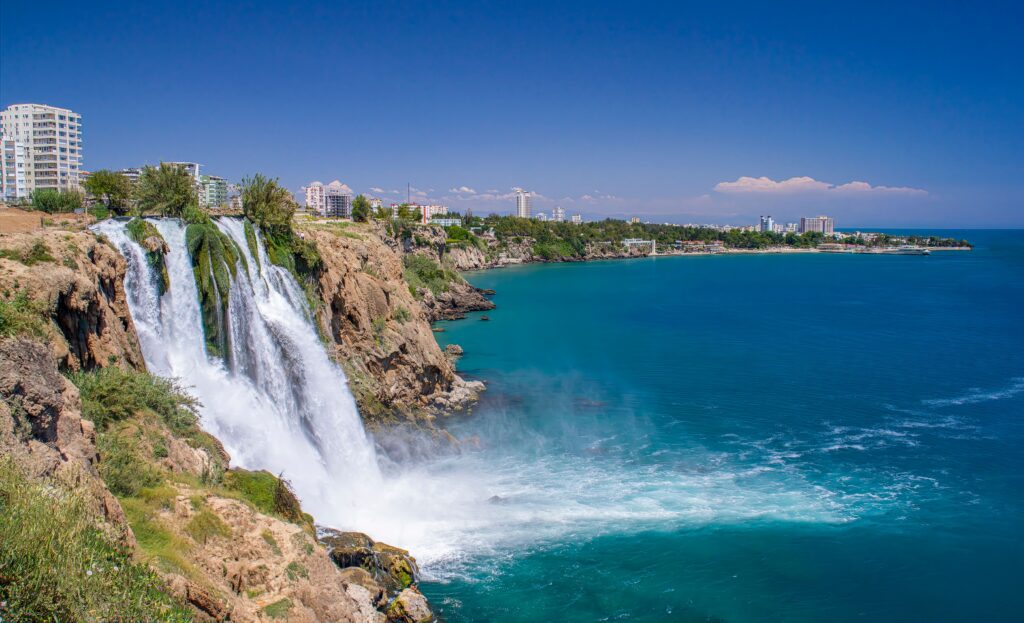 Duden Waterfalls cascading into the Mediterranean Sea in Antalya, panoramic view