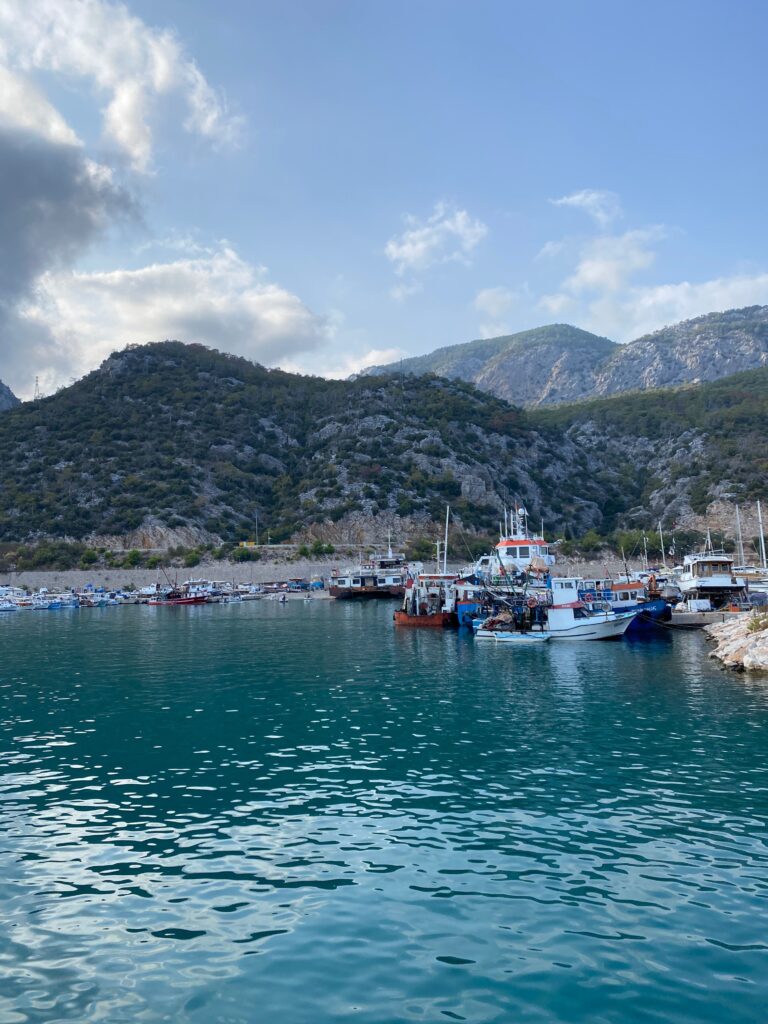 Antalya marina with fishing boats surrounded by mountains