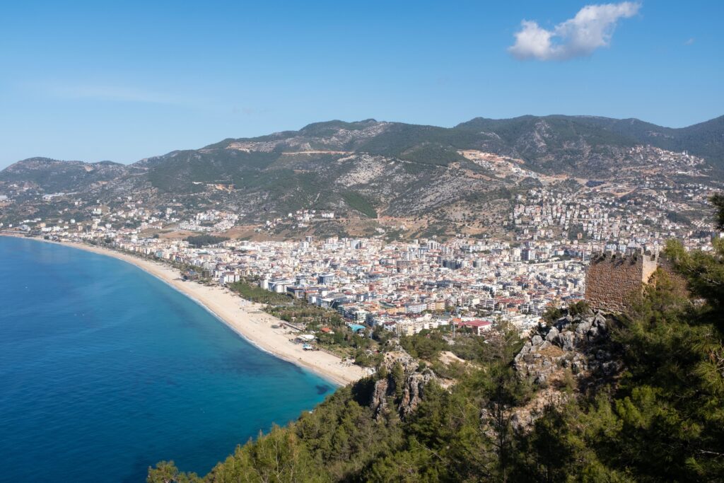 Aerial view of Alanya's coastline with mountains
