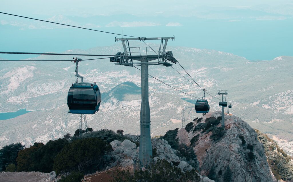 Cable cars traverse over rugged mountains near Antalya