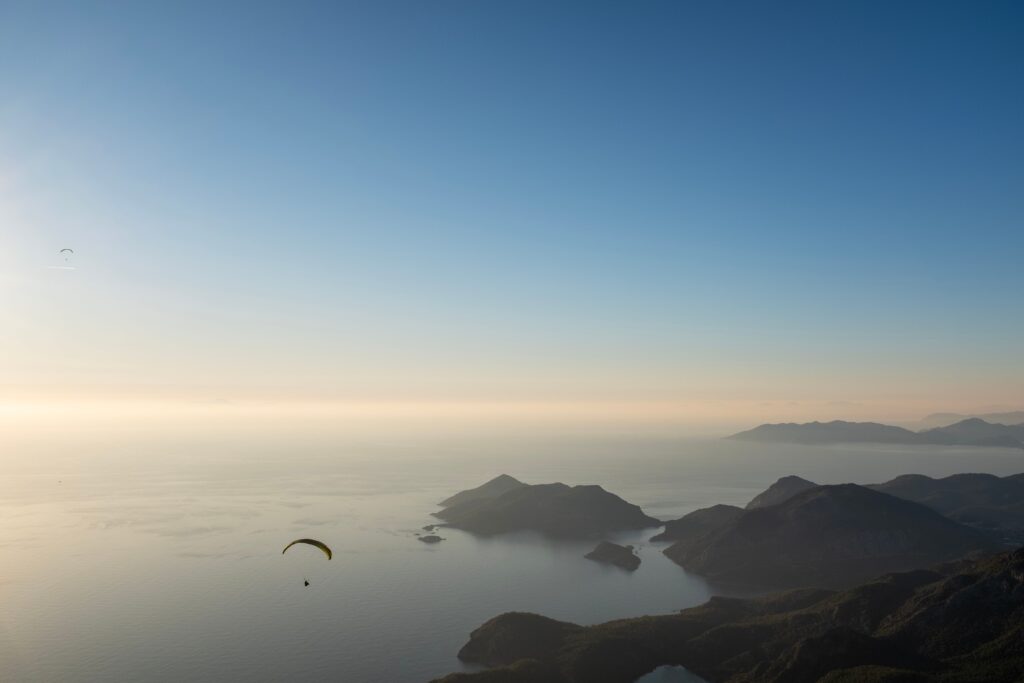 Paraglider over the serene bays near Antalya at sunset
