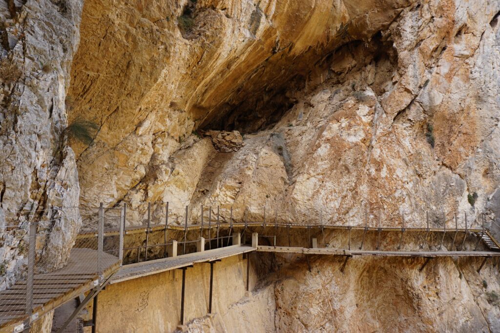 Dramatic cliffside walkway in a rocky gorge