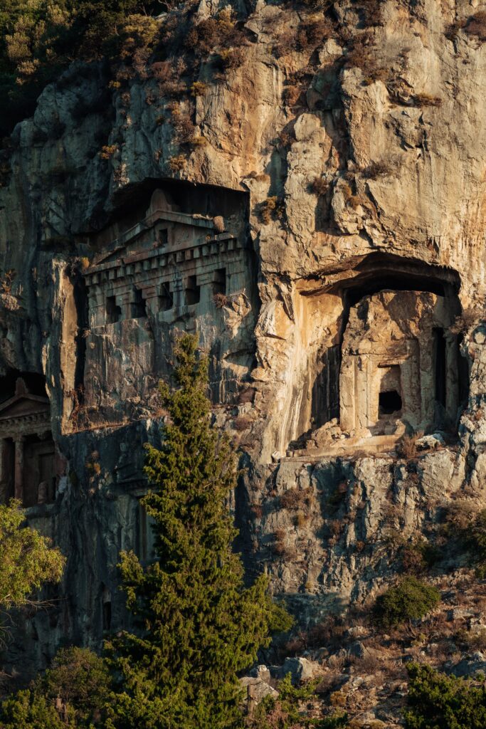 Ancient Lycian rock tombs carved into a cliff in Turkey