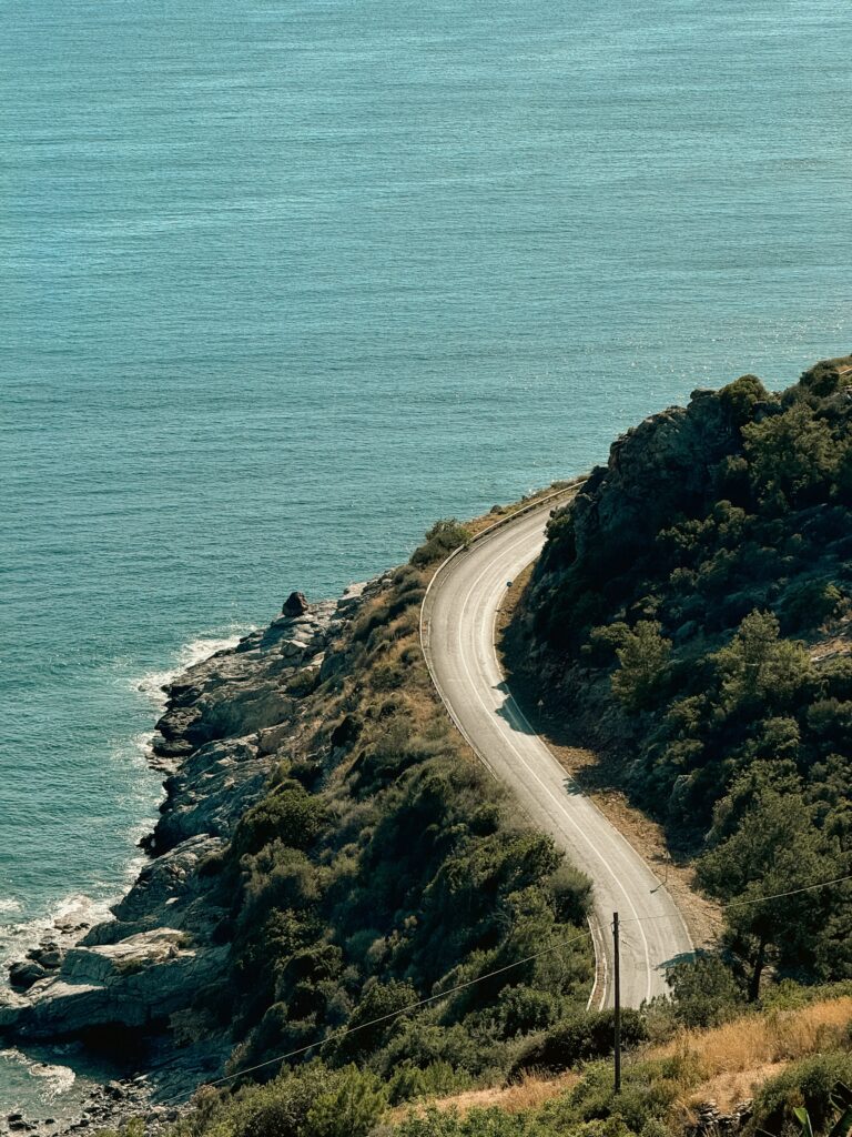 A winding coastal road above the turquoise Mediterranean along Turkey's Turkish Riviera