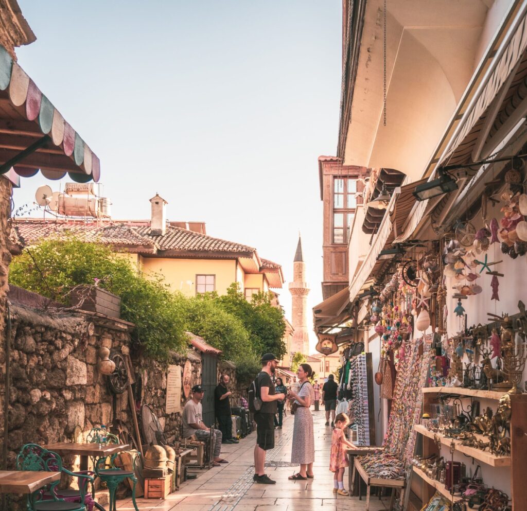 A narrow cobblestone alley lined with shops in Kaleici, Antalya's old town