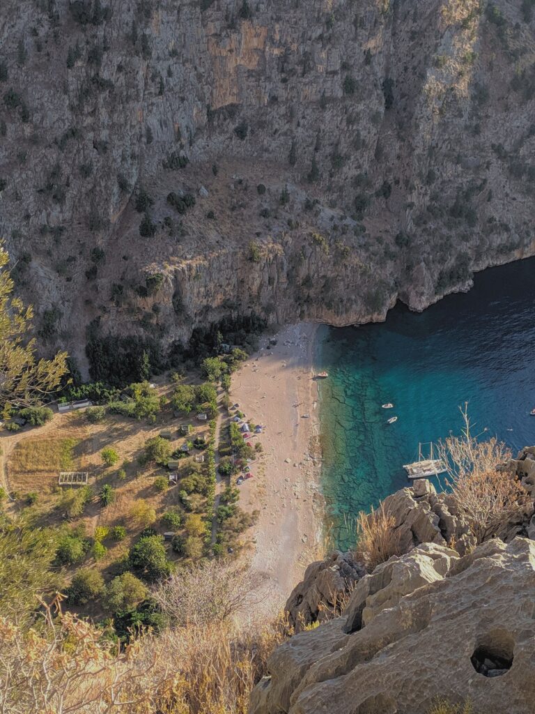 Aerial view of Butterfly Valley's turquoise water and beach near Ölüdeniz, Fethiye