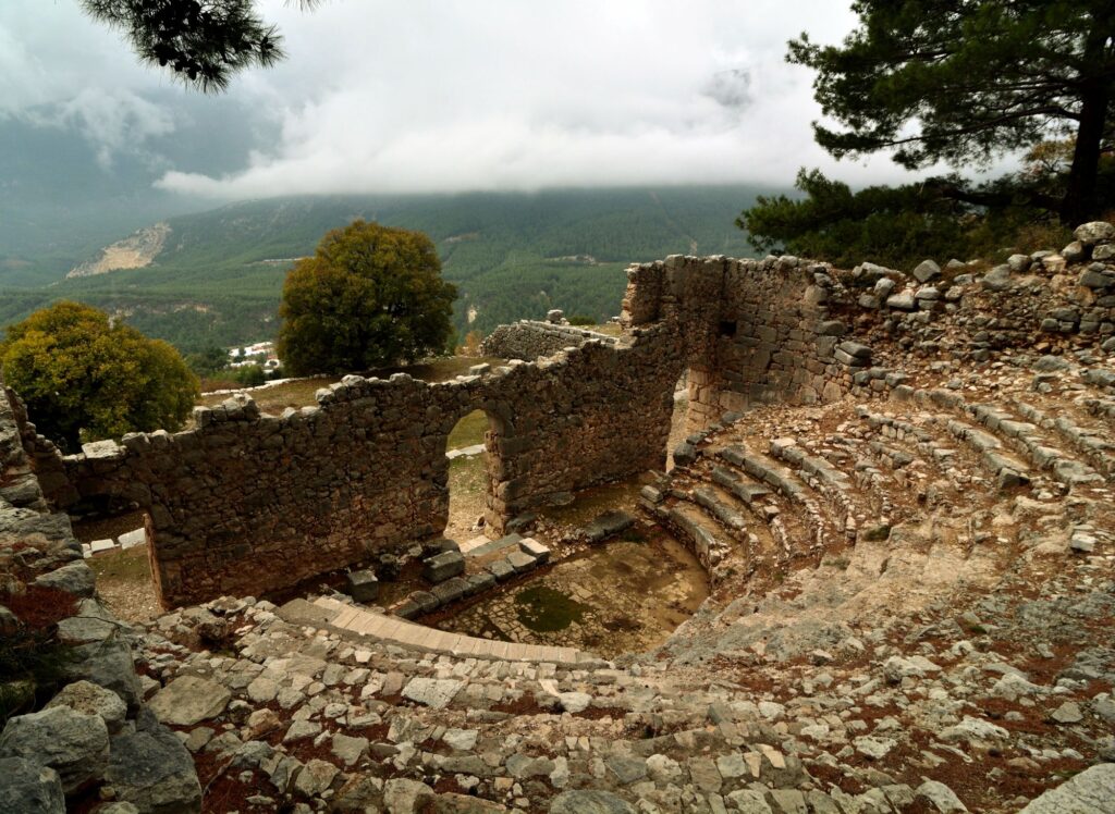 The theatre of Arykanda ancient city with the valley and mountains behind it