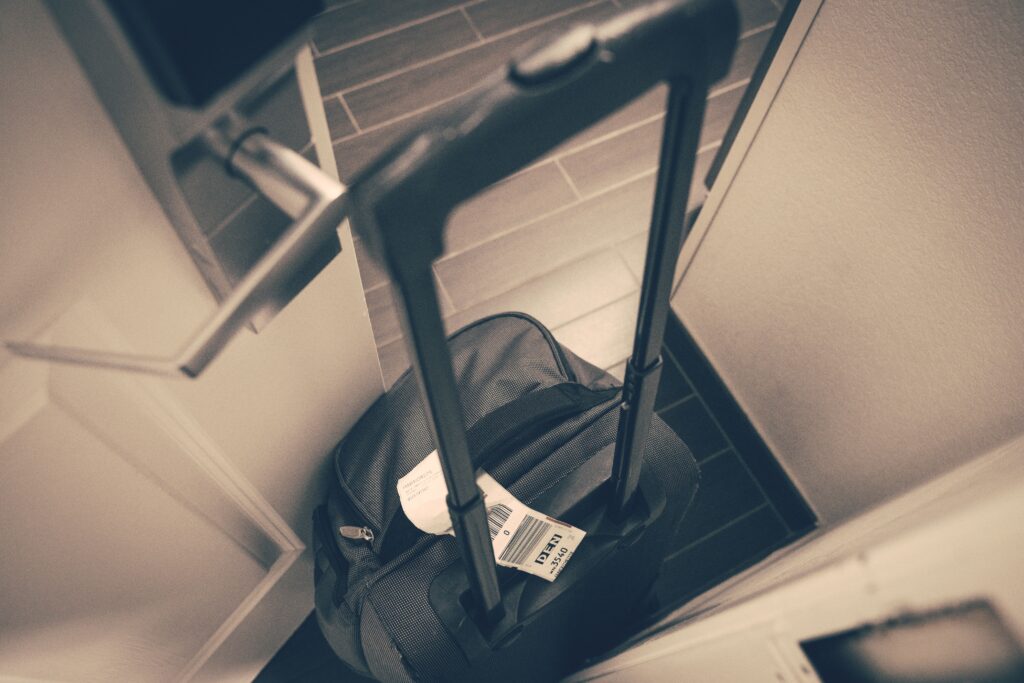 Travel suitcase beside a hotel room door near Antalya Airport