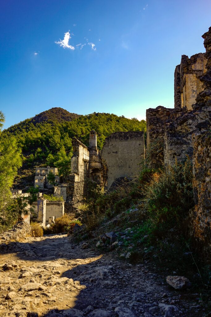 Abandoned stone houses of Kayaöy ghost village on the hillside near Ölüdeniz