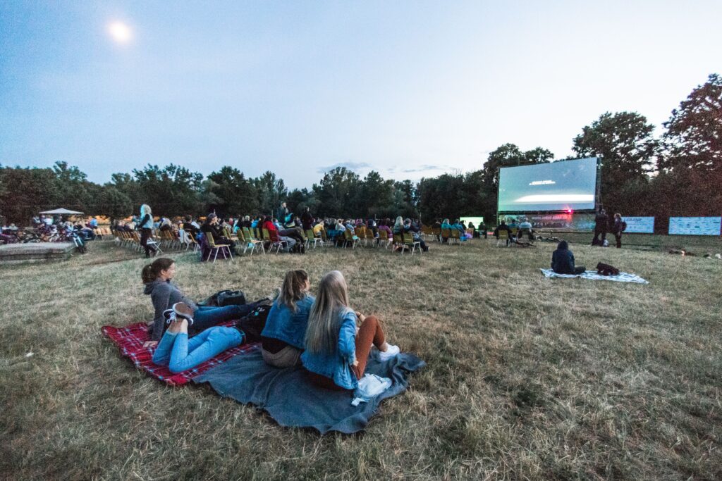 Audience watching an outdoor film screening, similar to a LikyaFF film festival session in Antalya