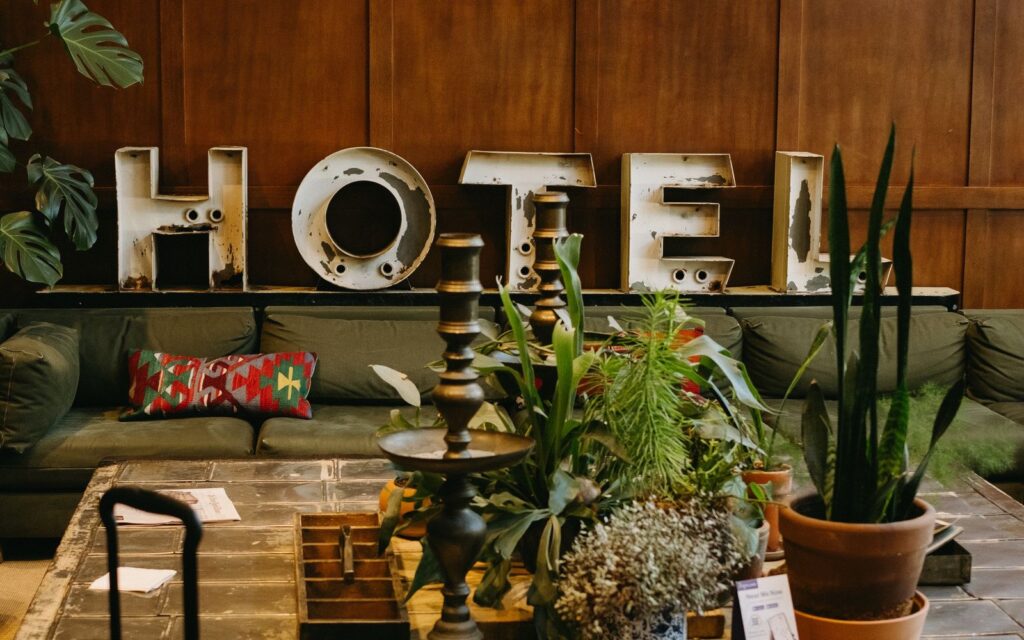 Black wheeled suitcase waiting in a hotel lobby after checkout