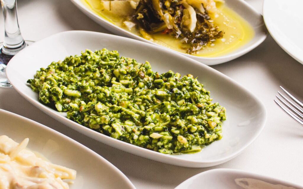 Small plates of Turkish meze with olive-oil greens, herb salad and spicy red pepper ezme