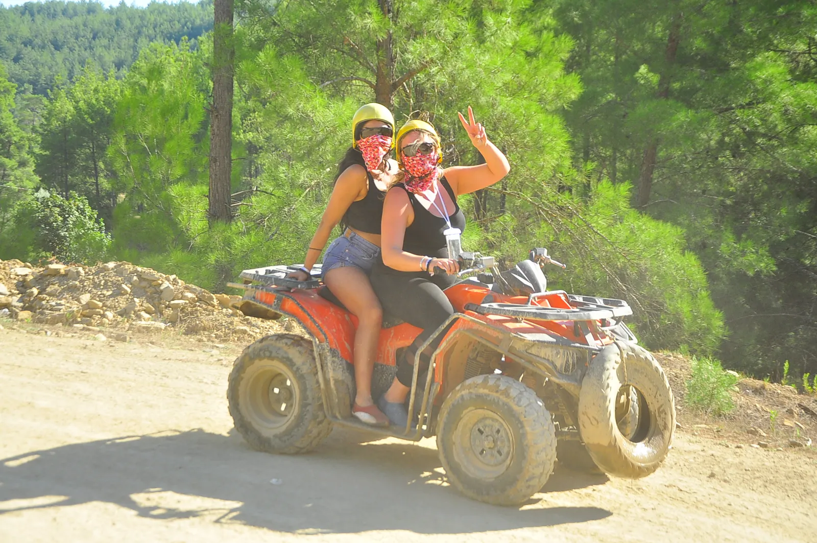 Two riders on a quad bike on a forest track during an Antalya quad safari