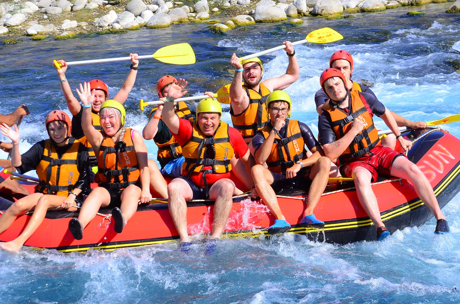 A group paddling through white water on the Köprüçay river during the Antalya rafting combo tour