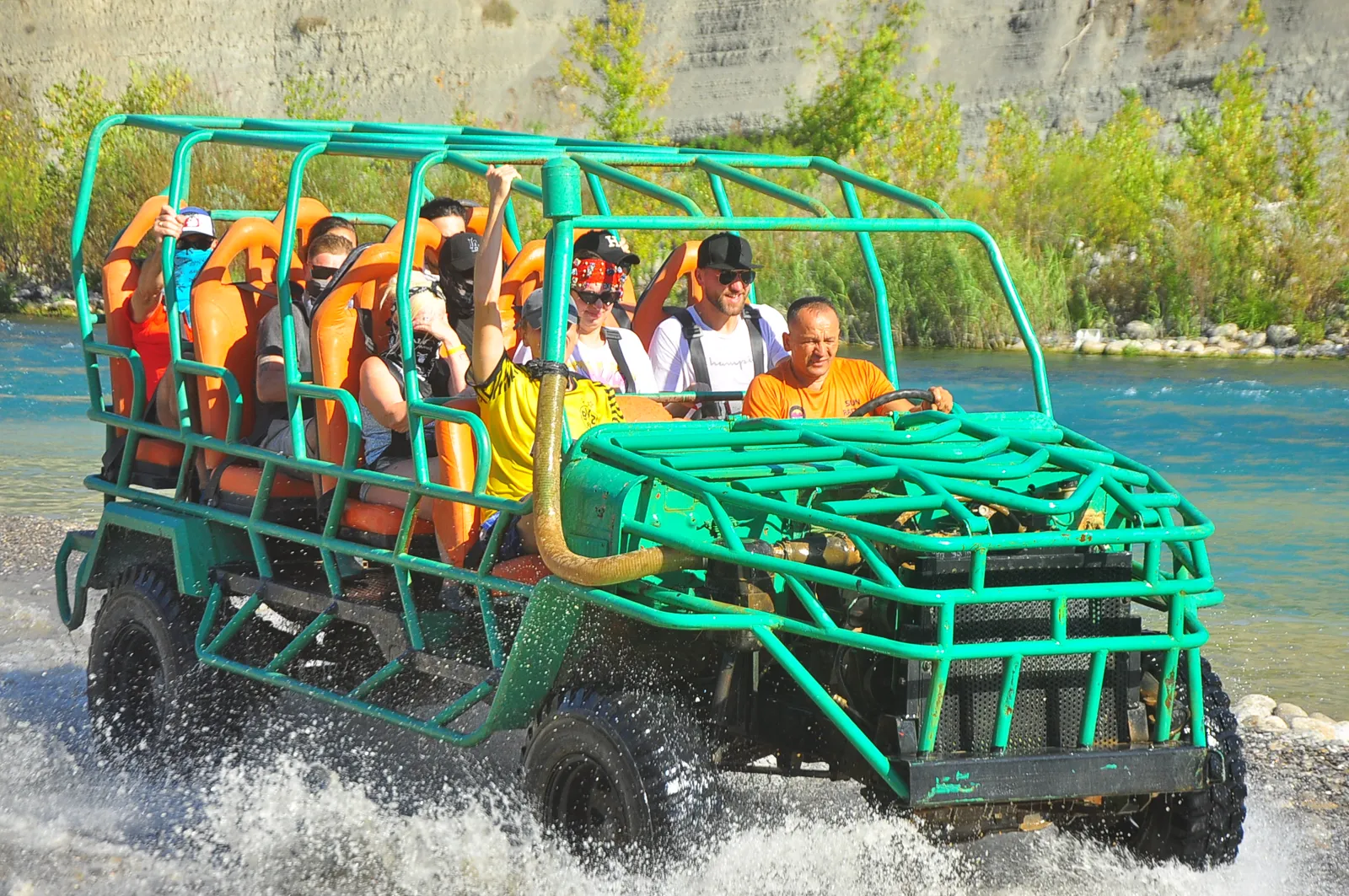 Monster Safari off-road truck splashing through the Köprüçay river near Antalya