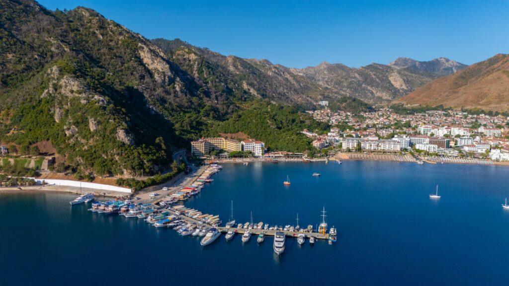 Aerial view of Marmaris bay and marina with mountains behind the town