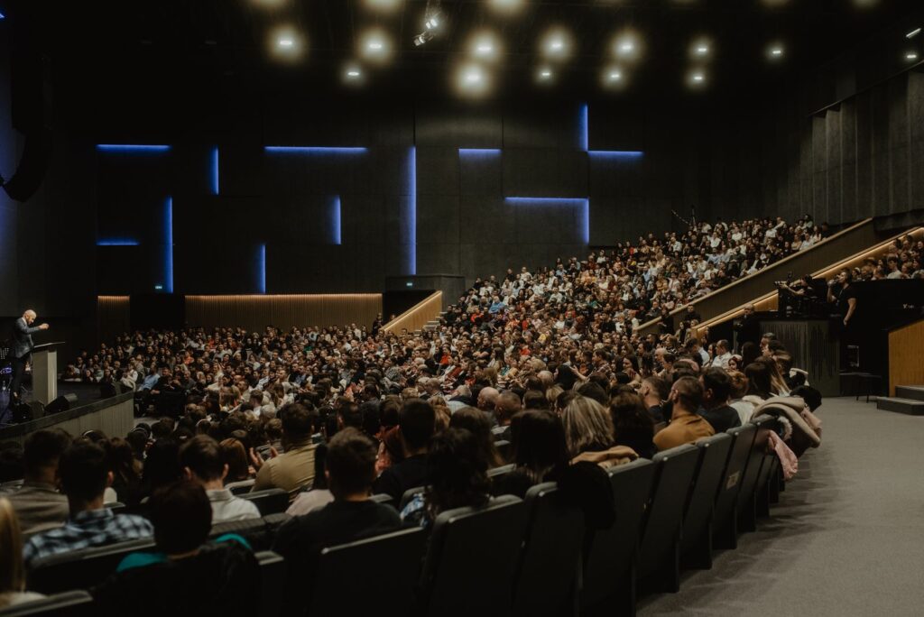 Delegates gathered in a large conference hall during an international event
